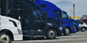 A row of delivery trucks in multiple sizes